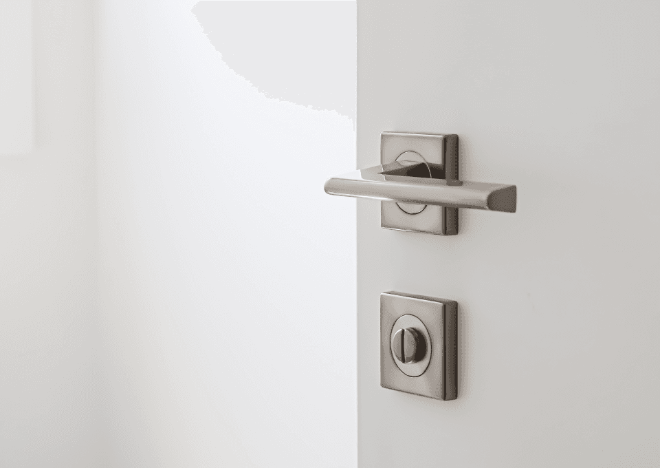 Satin nickel lever handle on a white residential door